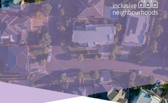 Aerial view of suburban street, rooftops and green trees and lawns. Logo ovrelay reads Inclusive communities
